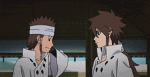two anime characters are standing next to each other and one has a bandage around his head