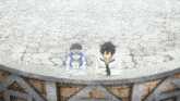 a man and a woman are sitting on a ledge on a stone floor