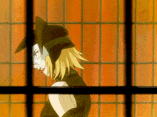 a woman in a cat mask is behind bars in a prison cell