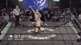 a wrestling ring with a logo that says iwtv live