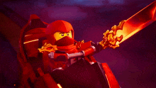 a lego ninjago character holding a sword in his hand