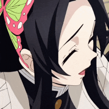 a close up of a girl with black hair and a butterfly on her head