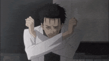 a man in a white lab coat has his hands crossed