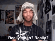 a man wearing a fur hat and a t-shirt with a star on it says really bitch really ?