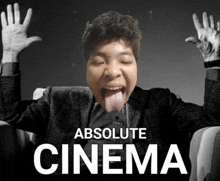 a man sticking his tongue out with the words absolute cinema below him