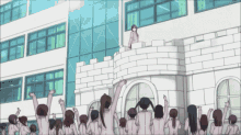 a group of people standing in front of a building