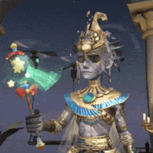 a statue of a man with a crown on his head is holding a staff