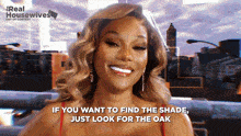 a woman is smiling with the words if you want to find the shade just look for the oak below her