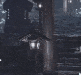 a lantern is hanging from a pole in a dark room