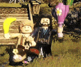 a couple of lego figures standing in a field