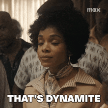 a woman says " that 's dynamite " in front of a group of people