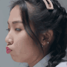 a close up of a woman 's face with her mouth open