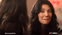 a close up of a woman 's face with #chicagofire written below her