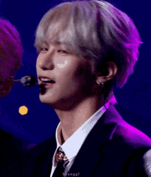 a close up of a man 's face with the word byunggf visible