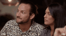 a man and a woman are sitting next to each other with the hashtag mafs