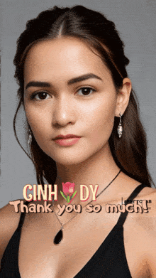 a woman is wearing a black tank top and earrings and the words thank you so much are above her