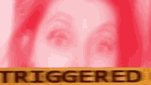 a close up of a woman 's face with a red background and the word triggered on it .