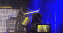 a pixelated image of a man playing drums with a barrel that says ' a ' on it