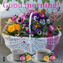 a picture of a basket of flowers with two cups of coffee