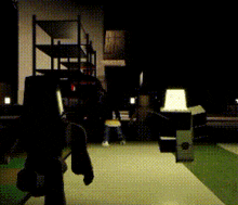 a person standing in a dark room with a yellow hat on their back