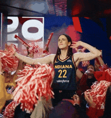 a woman in an indiana 22 salesforce jersey