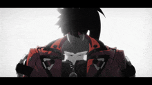 a man in a red jacket has a necklace around his neck that has the letter r on it