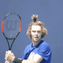 andrey rublev hair top knot tennis hairstyle
