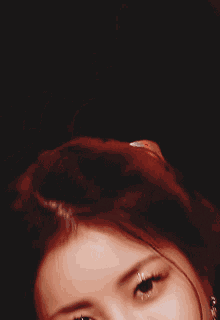 a close up of a woman wearing a microphone