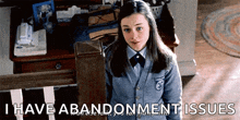 a girl in a school uniform is standing next to a staircase and says i have abandonment issues