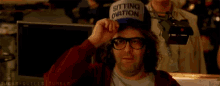 a man wearing a hat that says " i give up " on it