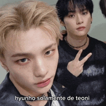 a close up of a person 's face with the words hyunho solamente de teoni on the bottom