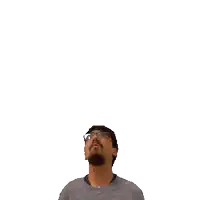 a man with glasses and a beard is looking up at the number 22