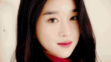 a close up of a woman 's face with the letter b on the bottom left
