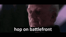 a close up of a man 's face with the words `` hop on battlefront '' written on the bottom .