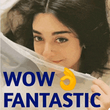 a woman covering her face with a white cloth with the words wow fantastic written below her