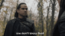 a man in a forest with the words we don 't know that below him