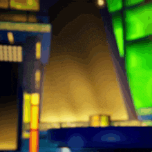 a blurry picture of a building with a green light in the background