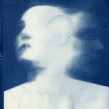 it is a blurry picture of a woman 's face .