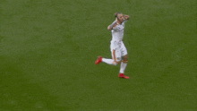 a soccer player with the number 27 on his back