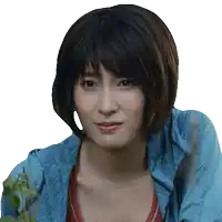 a woman with short hair is wearing a blue hoodie