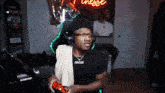 a man wearing headphones and a shirt that says finest on it