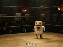 a toy chicken is standing in a boxing ring with the words b3 jockey below it
