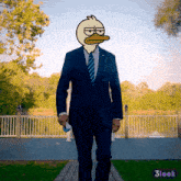 a man in a suit with a duck face on his head