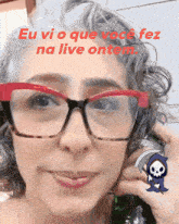 a woman wearing glasses has a grim reaper sticker on her face