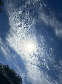 the sun is shining through the clouds in the sky