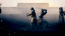 a group of samurai are standing in front of a building holding swords