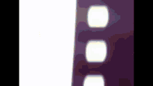 a close up of a purple film strip with white circles