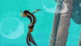 a cartoon character is swimming in a pool next to a bottle of lays chips .