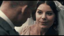 a man and a woman are looking at each other and the word mgm is on the screen
