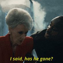 a man and a woman are standing next to each other and the woman says i said has he gone